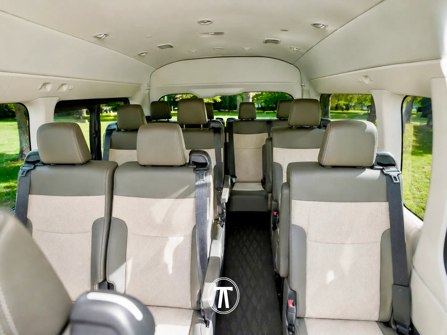Clean, comfortable van interior with beige leather seating